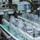 clear-glass-bottles-transfer-on-automated-conveyor-systems-industrial-automation-for-package